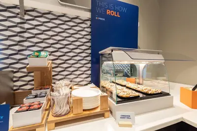 a display case with donuts and other pastries at Holiday Inn Express Calgary South by IHG in Calgary