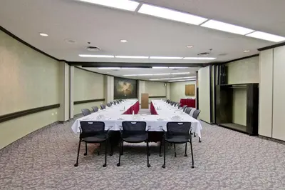 a large conference room with a long table and chairs at Chateau Lacombe Hotel in Edmonton