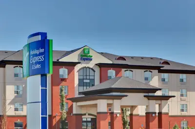 a sign for a hotel in front of a building at Holiday Inn Express Hotel & Suites Sherwood Park-Edmonton Area by IHG in Sherwood Park