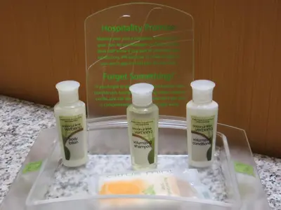 three bottles of moisturizers sitting on a tray on a counter at Holiday Inn Hotel & Suites-West Edmonton by IHG in Edmonton
