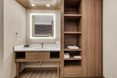 a bathroom with a sink and a mirror at Best Western Plus West Edmonton in Edmonton