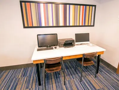 an office desk with a computer and a printer at Holiday Inn Express Hotel & Suites-Hinton by IHG in Hinton
