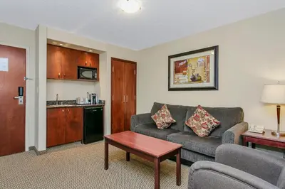 a living room with a couch and a table at Holiday Inn & Suites Lloydminster by IHG in Lloydminster