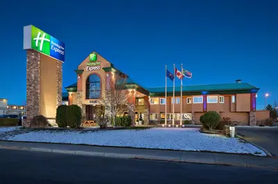 a hotel front of a building at night at Holiday Inn Express Red Deer by IHG in Red Deer