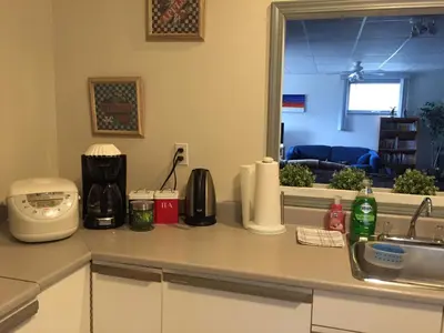 a kitchen with a counter top with a sink and a counter top at Bed & Breakfast Monarch in Canmore