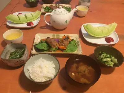 a table with plates of food and bowls of food at Bed & Breakfast Monarch in Canmore