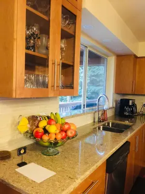 a bowl of fruit on a counter in a kitchen at Garden Bridge House in Sechelt