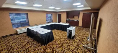 a conference room with a table and chairs in it at Holiday Inn Express & Suites Whitecourt by IHG in Whitecourt