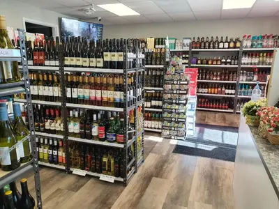 a store filled with lots of bottles of wine at Sundre Motor Inn in Sundre