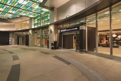 an empty shopping mall with a glass ceiling at Coast Coal Harbour Vancouver Hotel by APA in Vancouver