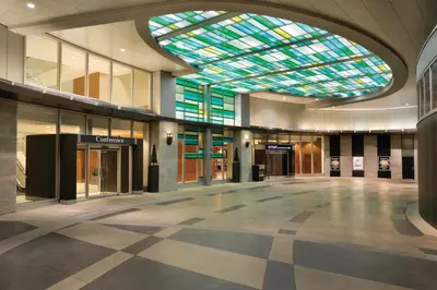 an empty lobby with a large skylight in a building at Coast Coal Harbour Vancouver Hotel by APA in Vancouver