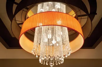 a large chandelier hanging from a ceiling at Coast Coal Harbour Vancouver Hotel by APA in Vancouver