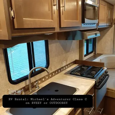 an rv kitchen with a sink and a window at Riverfront Bed and Breakfast in North Vancouver