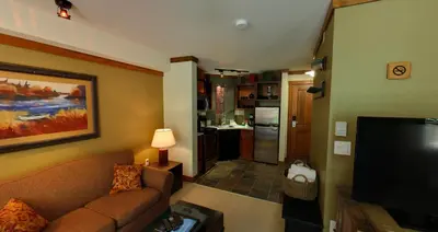 a living room with a couch and a flat screen tv at Embarc Panorama in Panorama