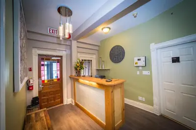 a hallway with a bar in the middle of a room at Cloudside Hotel in Nelson