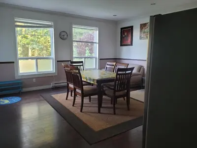 a dining room with a table and chairs at Vancouver Jenny's Guesthouse in Coquitlam