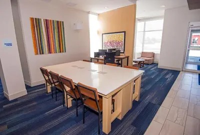 a conference room with a table and chairs at Holiday Inn Express - Red Deer North by IHG in Red Deer