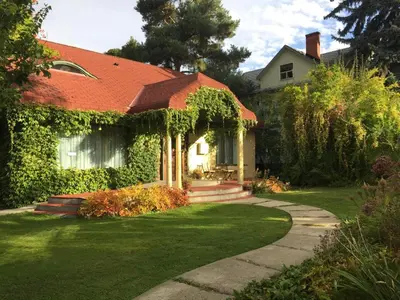 a house with an orange roof and a pathway at Mistiso's Place in Nelson