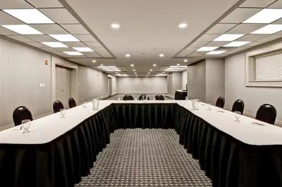 a large conference room with a long table and chairs at Chateau Nova Yellowknife in Yellowknife