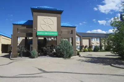 a building with a sign for a hotel at Rocky Inn Express in Rocky Mountain House