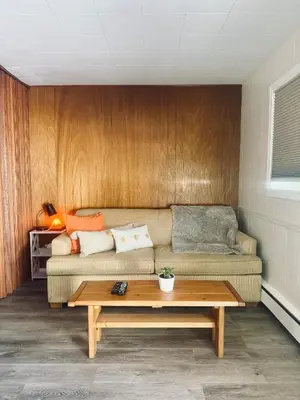 a living room with a couch and a coffee table at Barefoot Villas and Retreat in Christina Lake