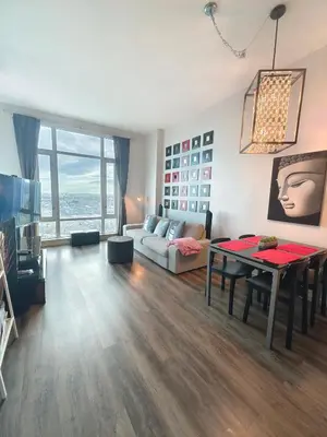 a living room with a couch and a table at Monki Di Executive Suites - Alura in Calgary
