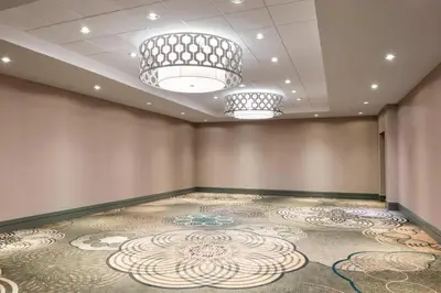 a room with a large carpeted room with two lights at Sheraton Vancouver Airport Hotel in Richmond
