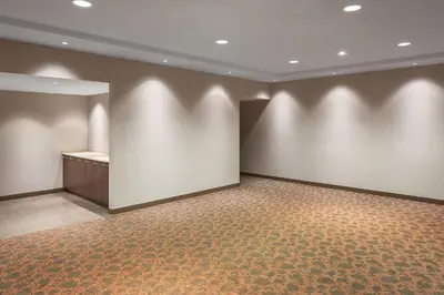 a large room with white walls and a podium at Sheraton Vancouver Airport Hotel in Richmond