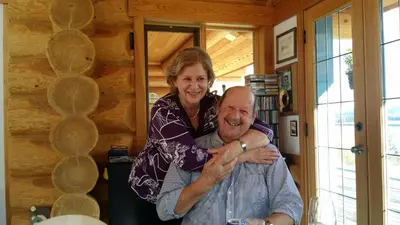 a woman standing on top of a man at Little Black Bear Lodge/B&B in Bridge Lake