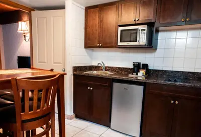 a kitchen with a sink and a microwave at Charltons Banff in Banff