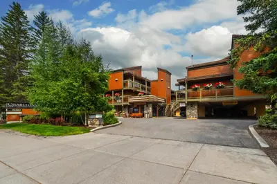 an empty parking lot in front of a building at Charltons Banff in Banff