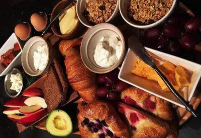 a plate of food with different types of food at A Suite Retreat - Beyond Bed & Breakfast in Sun Peaks