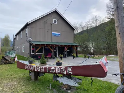 a boat on display in front of a barn at Stewart Mountain Lodge in Stewart