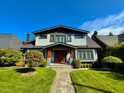 a house with a pathway leading to the front door at Bay View House in Vancouver