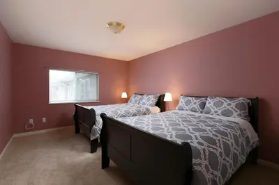 a bedroom with a bed and a window at Muchen Villa in Delta