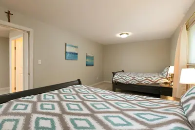 a bedroom with two beds and a window at Muchen Villa in Delta