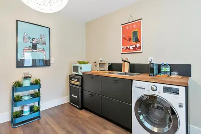 a laundry room with a washer and dryer at Boutique in Vancouver