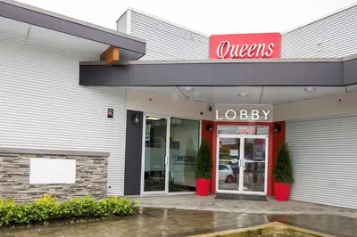 a store front with a sign for a loblaws at Queens Hotel in New Westminster