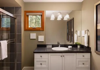 a bathroom with a sink and a shower at Outback Lakeside Vacation Homes in Vernon