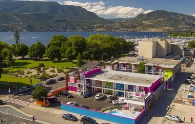 an aerial view of a building with a parking lot at Hotel Zed Kelowna in Kelowna