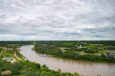 an aerial view of a river with a boat on it at Courtyard by Marriott Edmonton Downtown in Edmonton