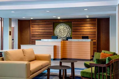 a lobby with a waiting area with a couch and chairs at Fairfield Inn & Suites by Marriott Kelowna in Kelowna