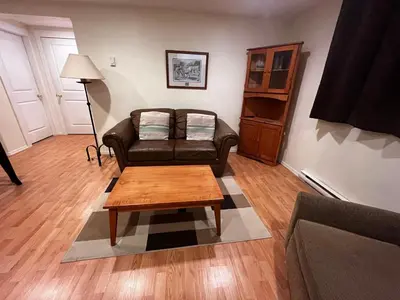 a living room with a couch and a coffee table at Revelstoke Long Term in Revelstoke
