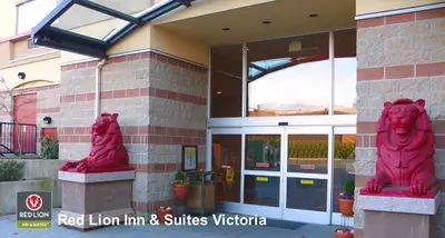 two red lion statues in front of a building at Red Lion Inn and Suites Victoria in Victoria
