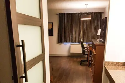 a room with a desk and a window with a desk sidx sidx sidx at Quality Inn West Edmonton in Edmonton