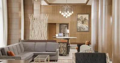 a living room with a couch and a table at River Cree Resort & Casino in Edmonton