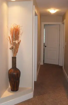 a vase sitting on a shelf in a hallway at Mountain View Radium Condo - Copper Horn Village in Radium Hot Springs