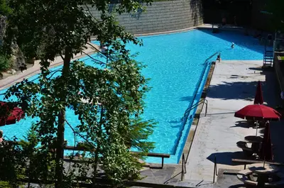 an overhead view of a large blue swimming pool at Mountain View Radium Condo - Copper Horn Village in Radium Hot Springs