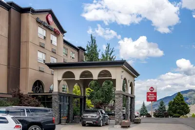 a hotel with a car parked in front of it at Best Western Plus Kamloops Hotel in Kamloops