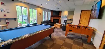 a billiard room with a pool table in it at Sunset Resorts Canmore and Spa in Canmore